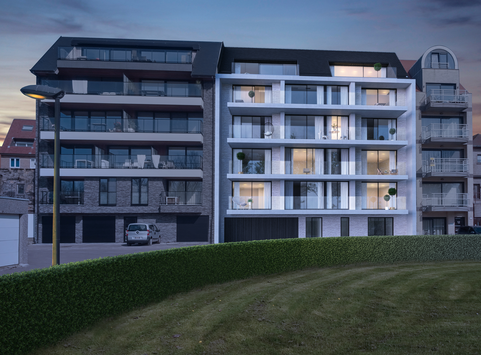 appartementen verlicht bij schemering met zicht op het park